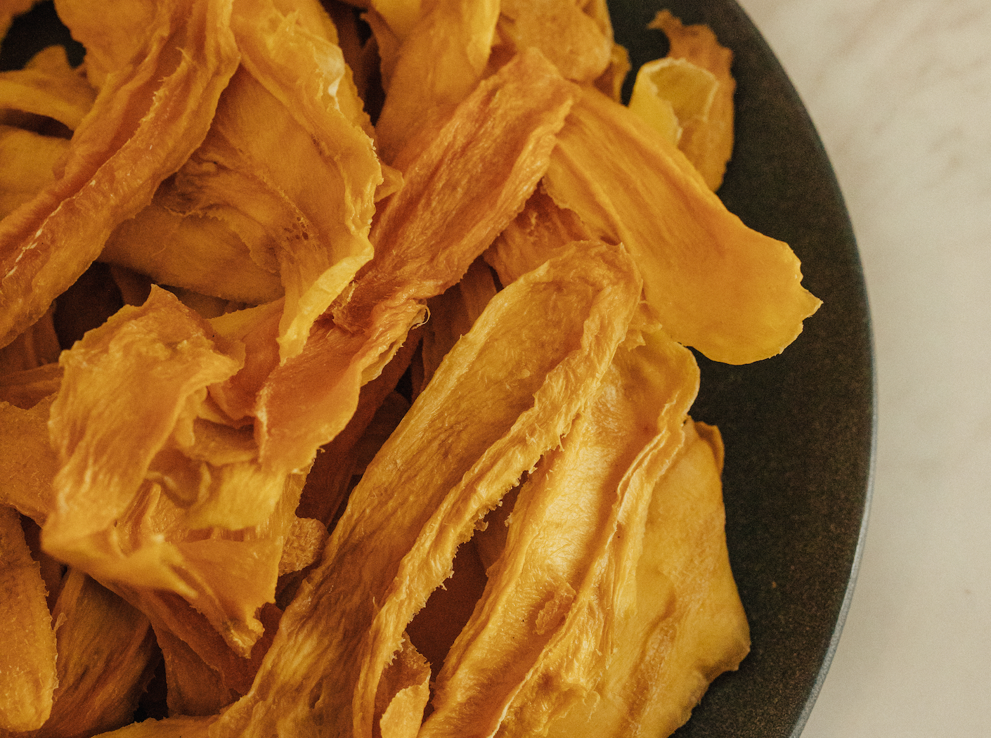 Delicious, organic dried mango strips from San Blas, Nayarit, Mexico, ready to eat on a plate